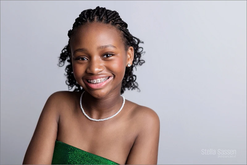 young teenager smiling widely for glamour photo shoot